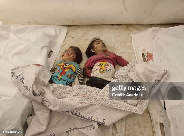deir-al-balah-gaza-lifeless-bodies-of-two-toddlers-lie-among-others-after-bodies-of-the-3175086880.jpg